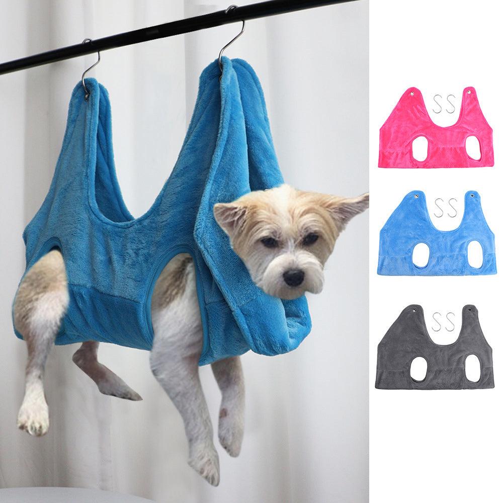 Blue dog grooming hammock harness worn with two leg openings and neck strap