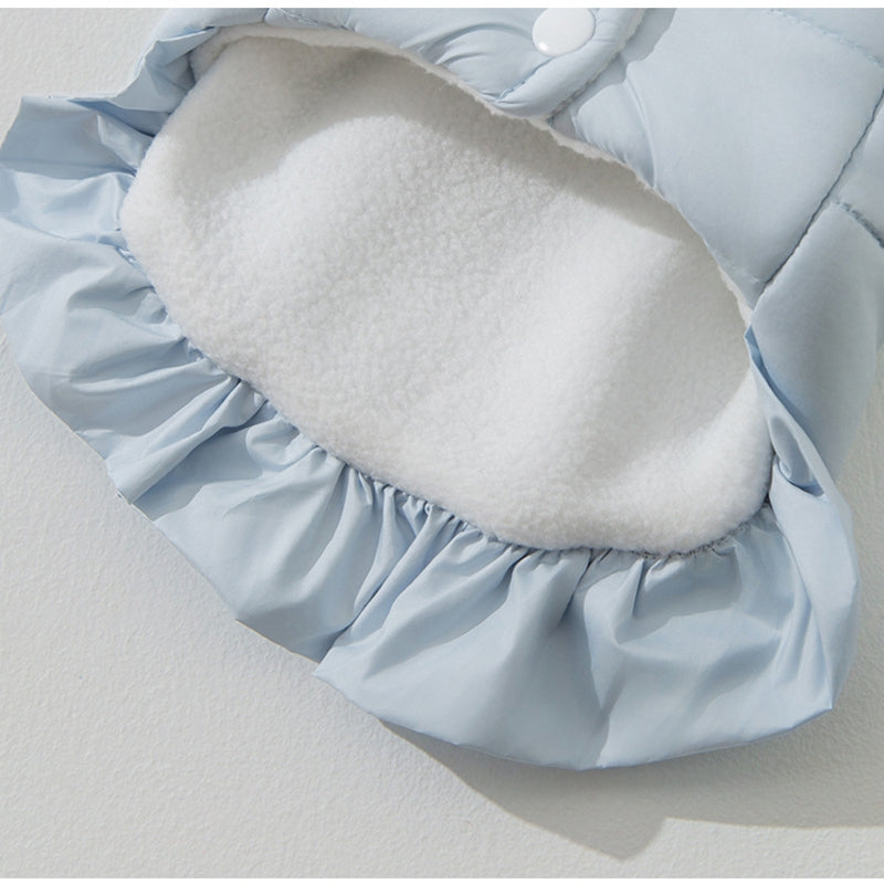 Light blue padded pet vest with oval white plush belly panel and gathered edge