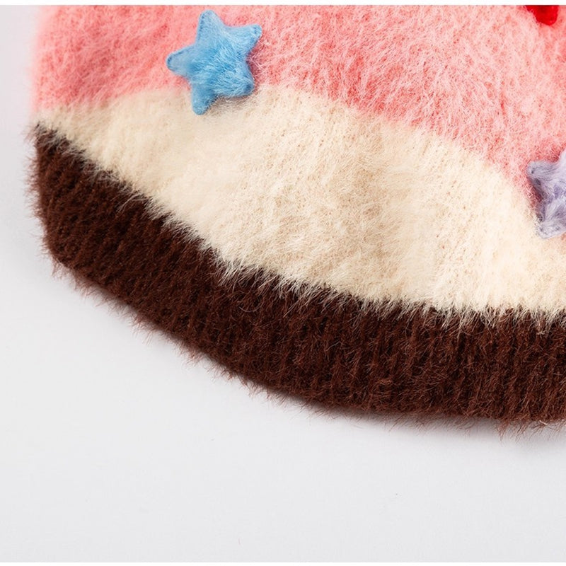 Striped knit hem, white middle with dark brown band and blue star accents