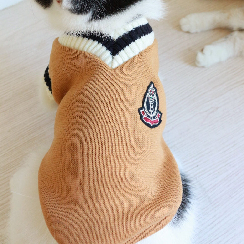 Cat knit sweater vest, tan/brown with striped collar and small crest patch