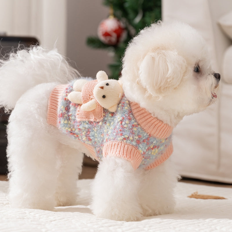 Blue knit pet sweater with orange ribbing and teddy bear pocket, side view on dog
