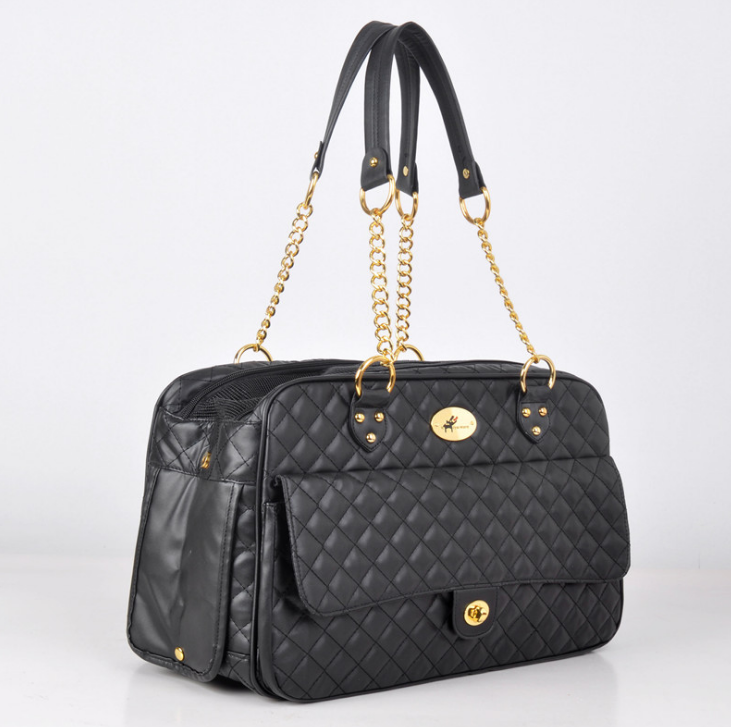 Black quilted pet duffel bag with top handles, front flap, and gold hardware