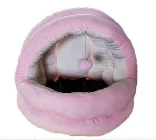 Pink round cat cave bed with plush interior and hanging ball toy