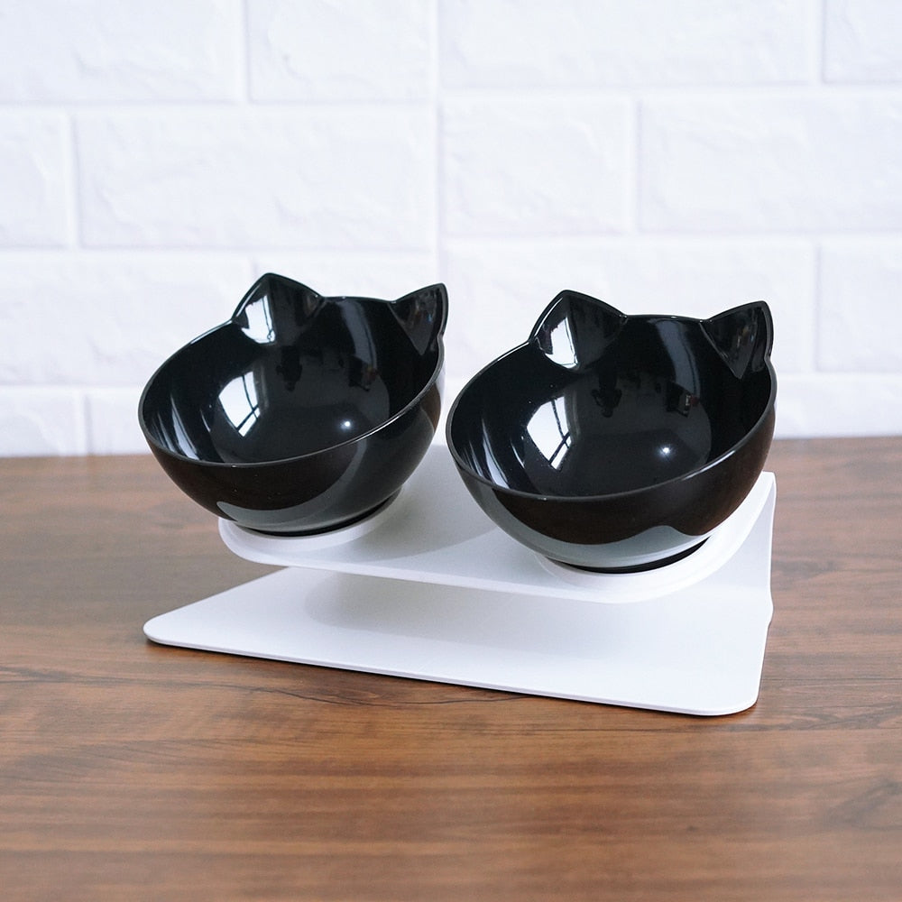 Double raised pet food bowl set with two black cat-shaped bowls on white base