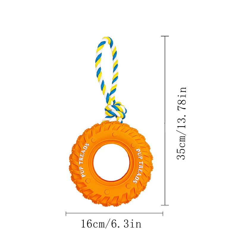Orange rubber tire tug toy with yellow and blue braided rope