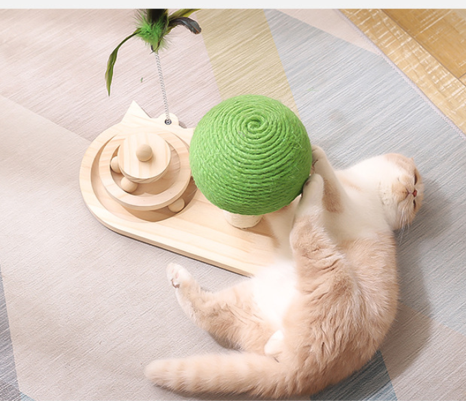 Green sisal ball on post over wooden scratch board; cat paws at dangling feather toy