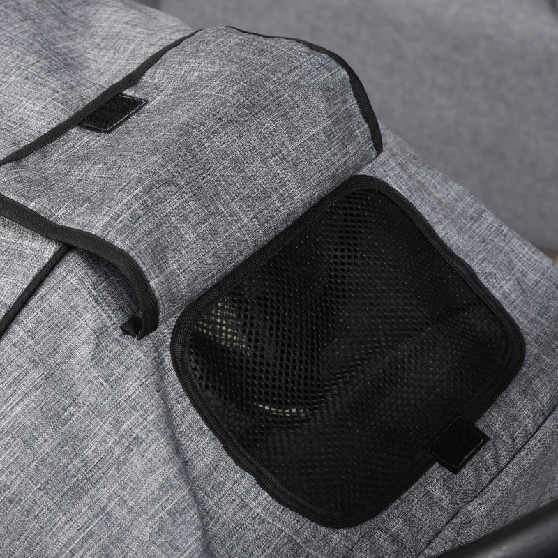 Pet stroller seat detail with black mesh panel on gray fabric, top view