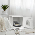 White cat house side table with open front door and grey litter tray inside