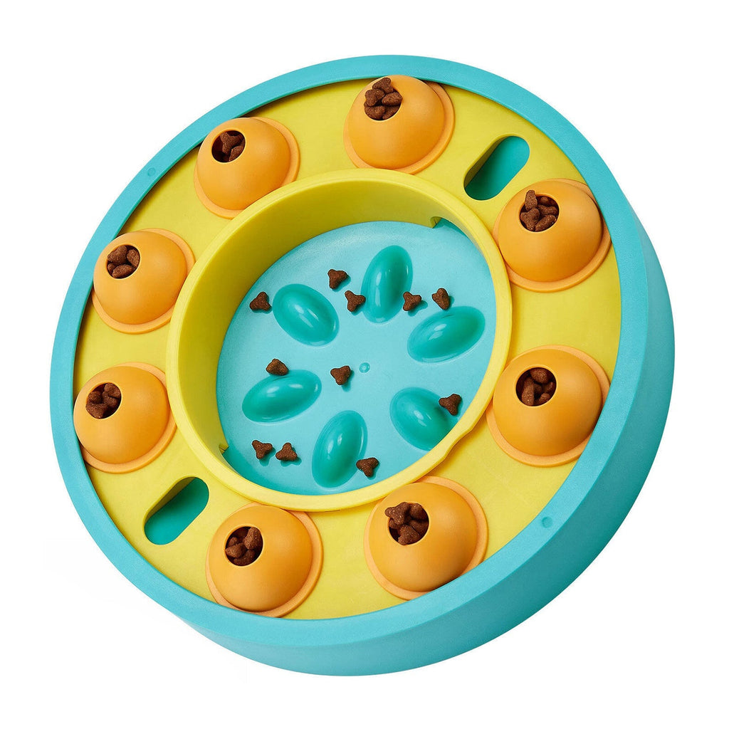 Slow feeding puzzle dog bowl with blue interior, teal center bumps, orange treat cups