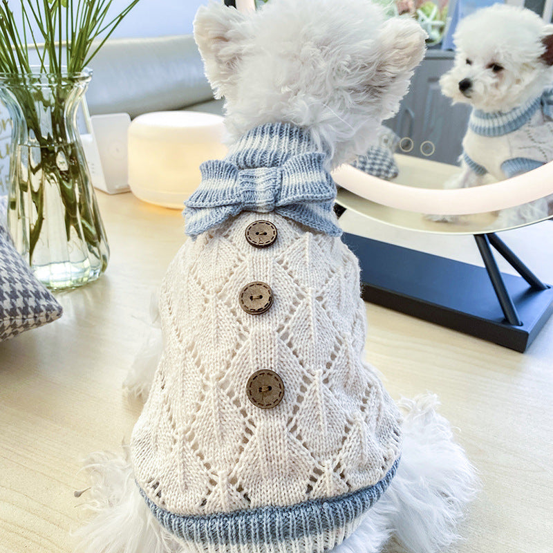 Cream hollow-knit dog sweater with blue ruffled collar and round button details