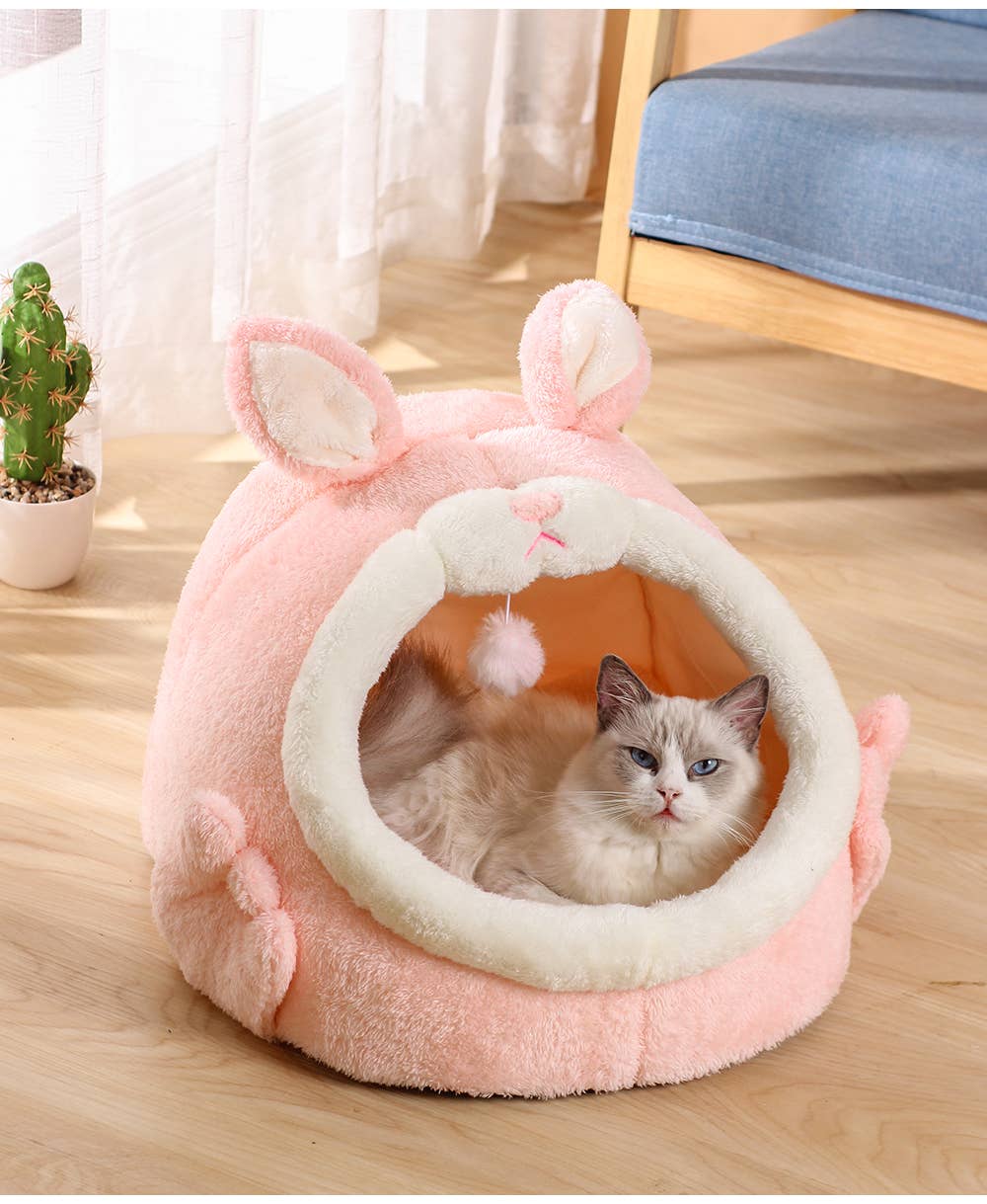 Pink rabbit-shaped cat cave house with round entrance and soft plush interior