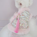 Pink and blue patterned pet jacket with white faux-fur collar, tassel and bow charms
