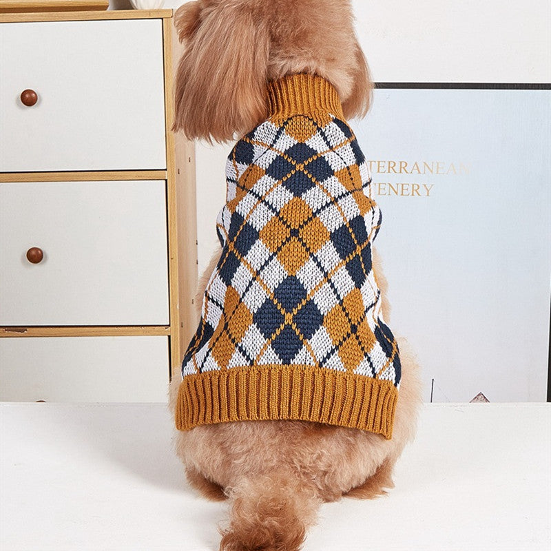 Dog plaid sweater vest with tan knit turtleneck and mustard-orange hem