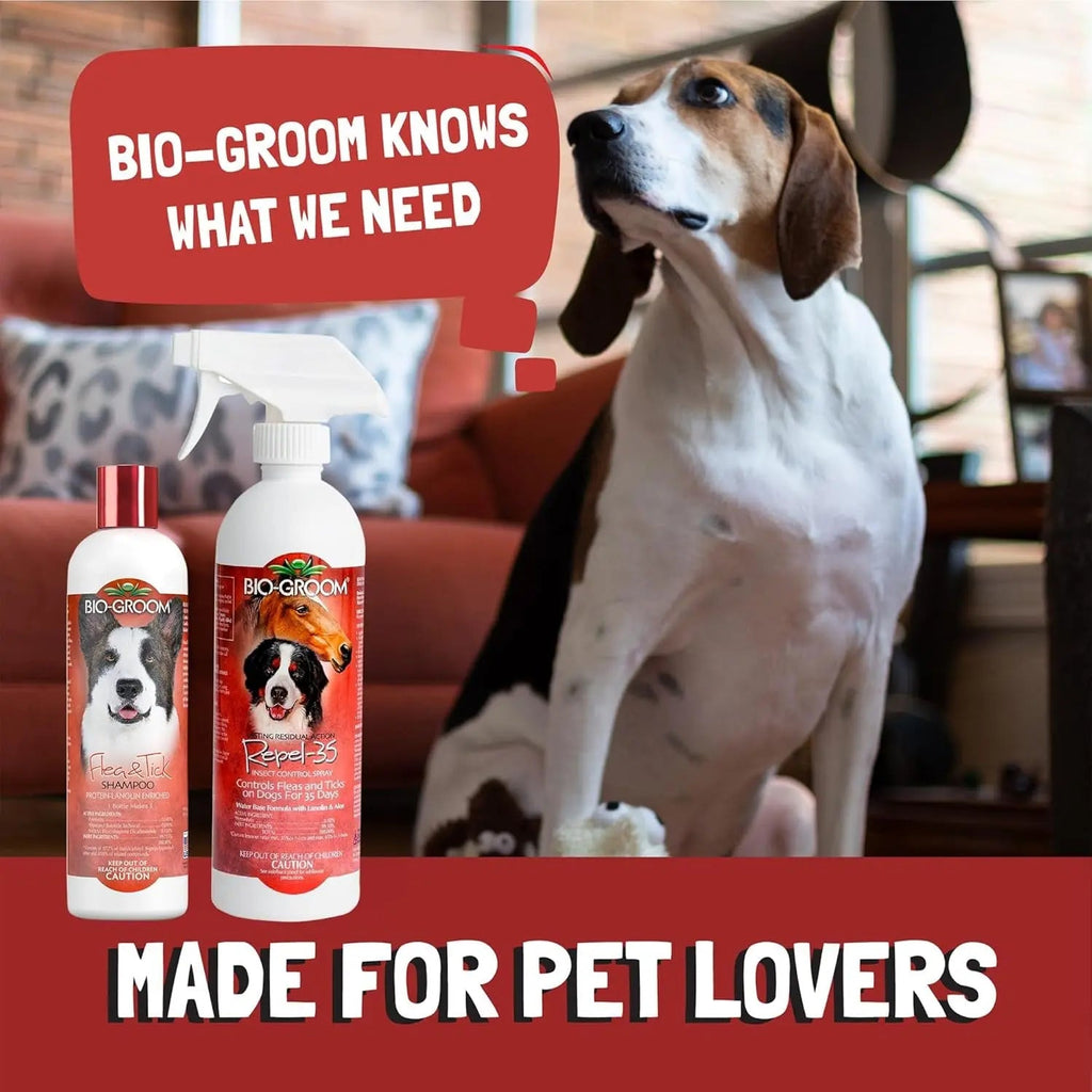 Two Bio-Groom pet care bottles with red caps and white spray tops