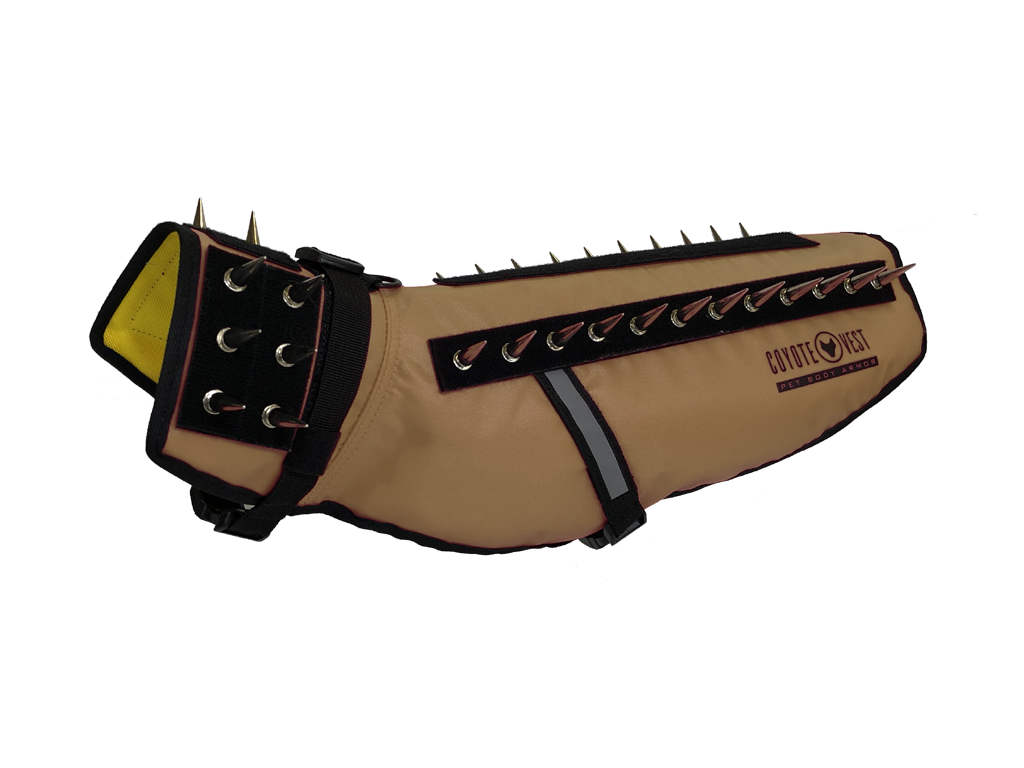 Tan spiked dog vest with black studded strap panel and adjustable side buckles