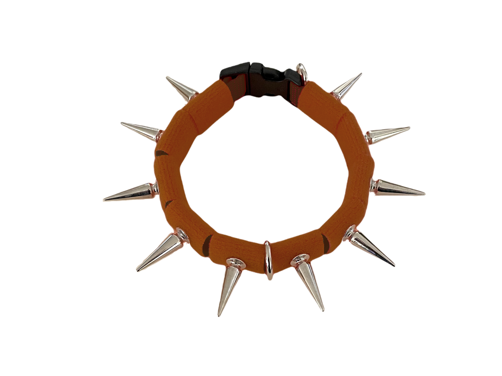 Coyote collar brown fabric ring with silver spikes and metal clasp at back.