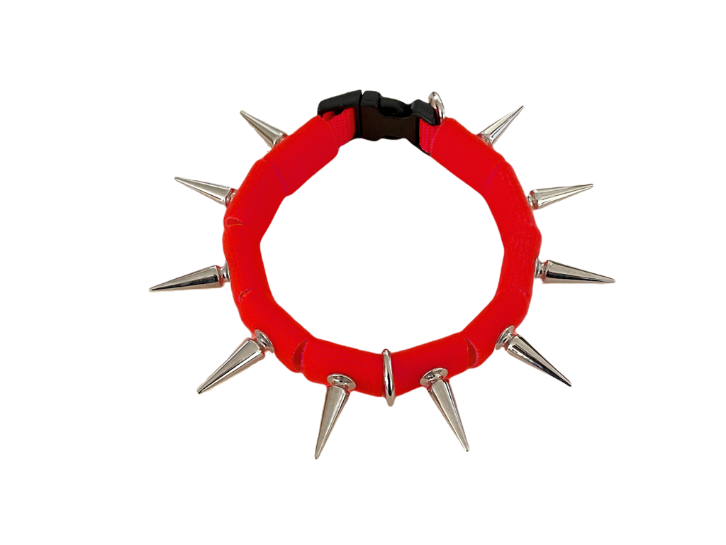 Coyote collar red fabric ring with silver spikes and metal clasp at back.