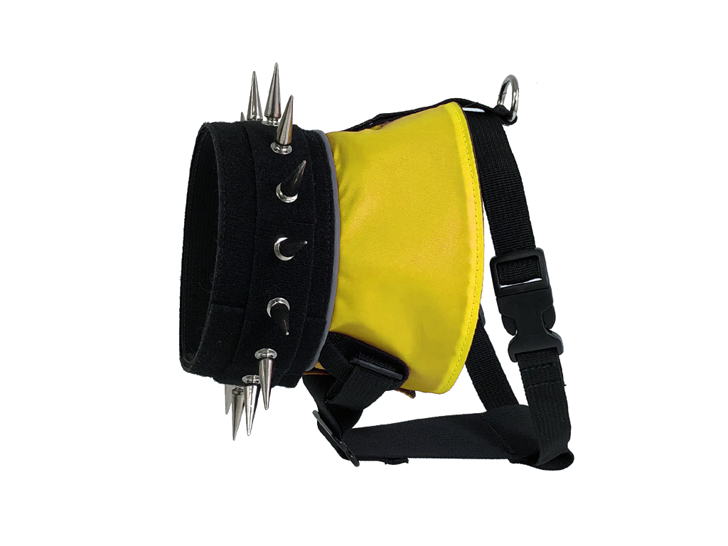 Yellow dog harness with black webbing, metal spikes, and adjustable shoulder strap