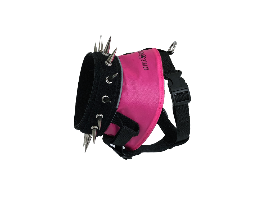 Spiked dog harness with neon pink panel, black straps, metal spikes and studs