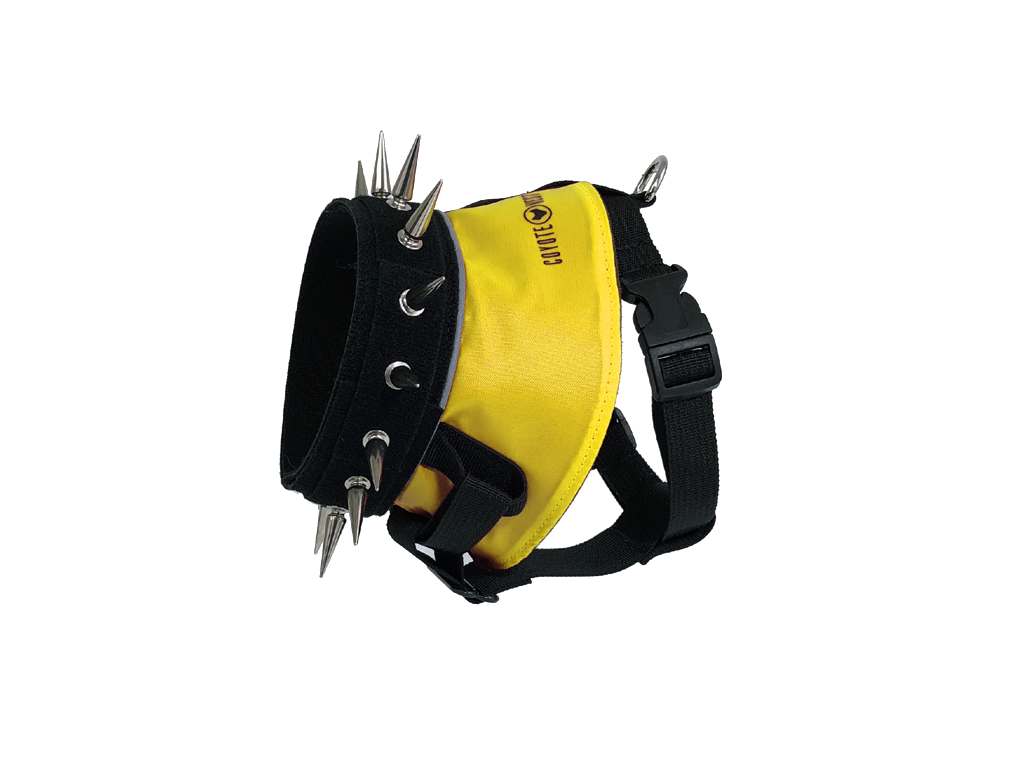 Spiked dog harness with yellow panel, black straps, metal spikes and studs