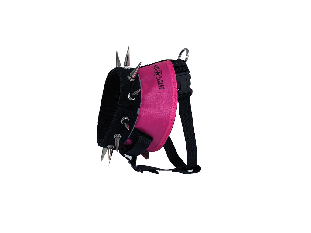 Spiked dog harness with neon pink panel, black straps, metal studs and spikes