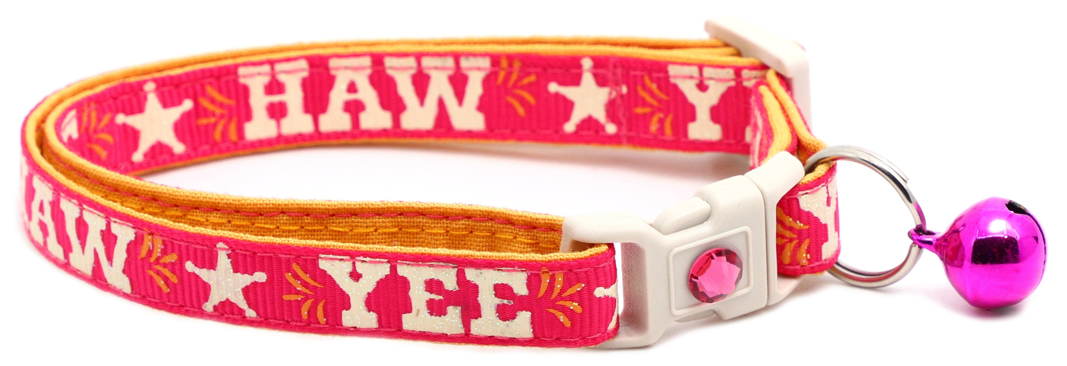 Pet breakaway collar with red fabric, HA W pattern, white buckle, pink bell charm and tag