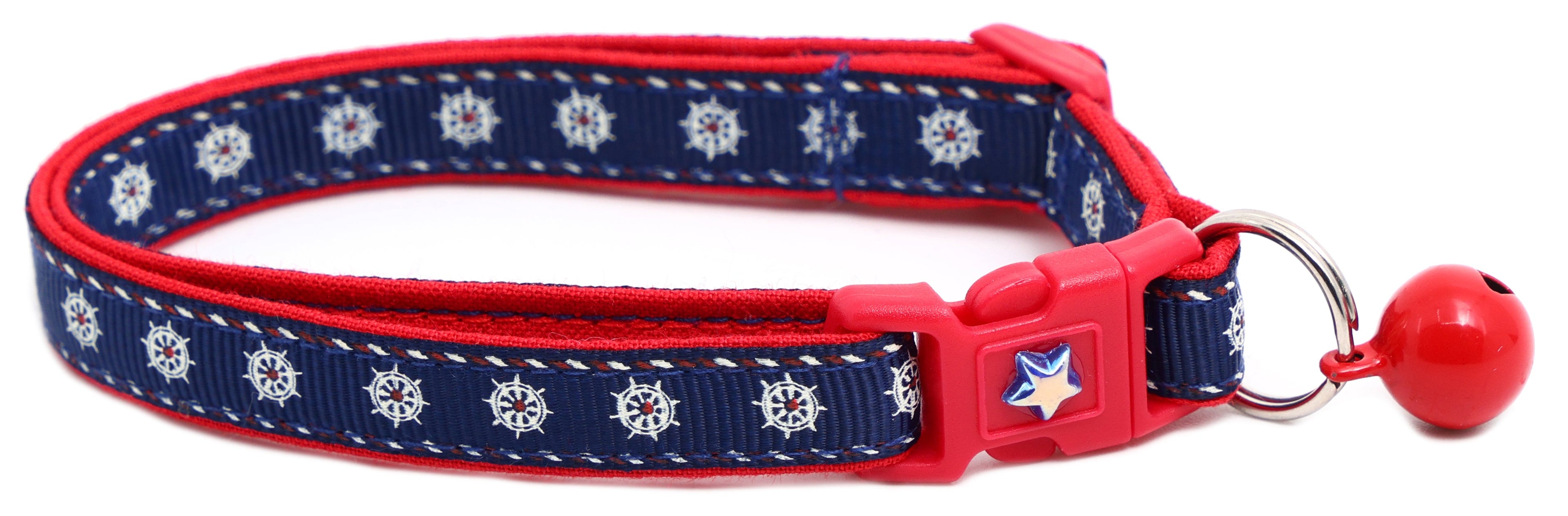 Navy ships wheel breakaway cat collar with red trim; red breakaway buckle and bell.