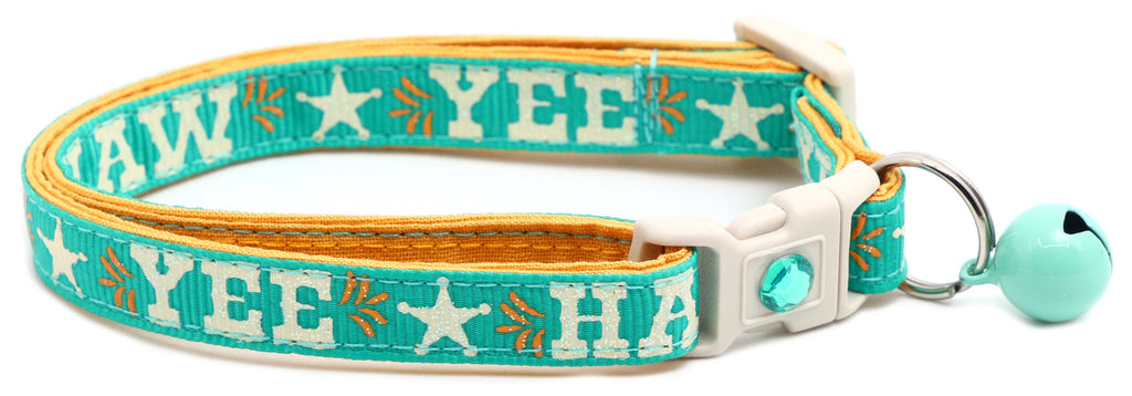 Breakaway dog collar with “YEE HAW” print, aqua and yellow trim, teal jingle bell