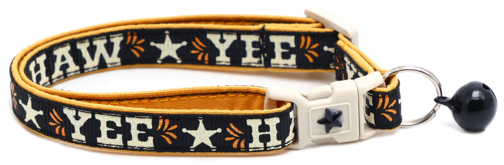Breakaway collar in dark navy with orange trim, star pattern, silver clasp and black bell