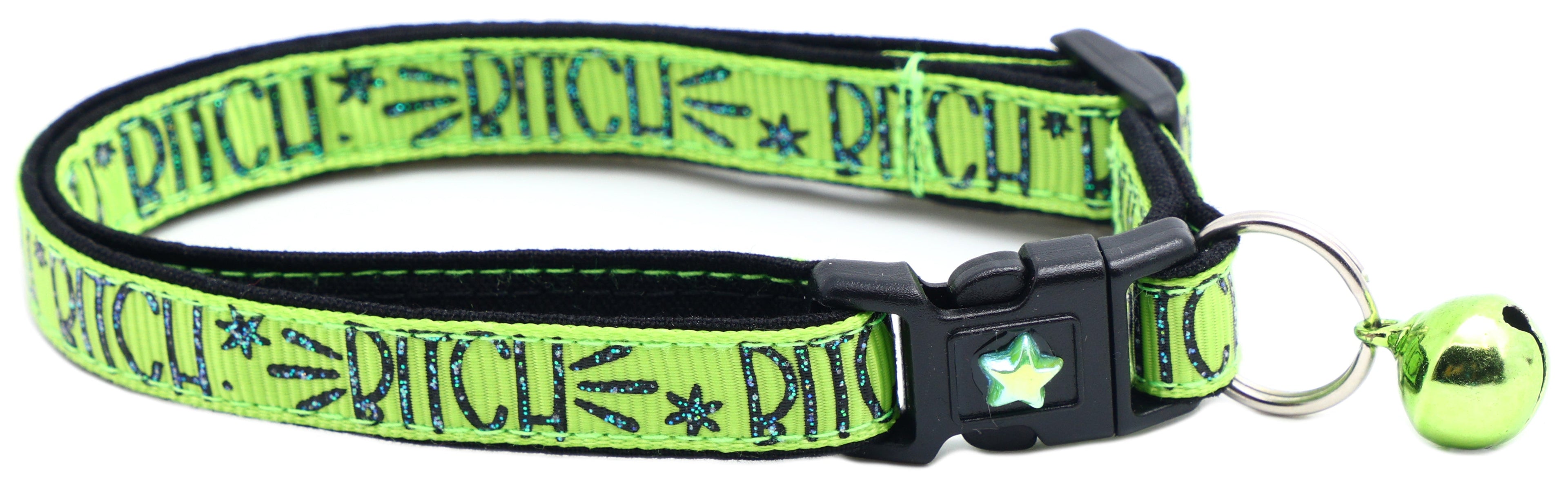 Neon green breakaway cat collar with black buckle, star charm and metal ring bell.