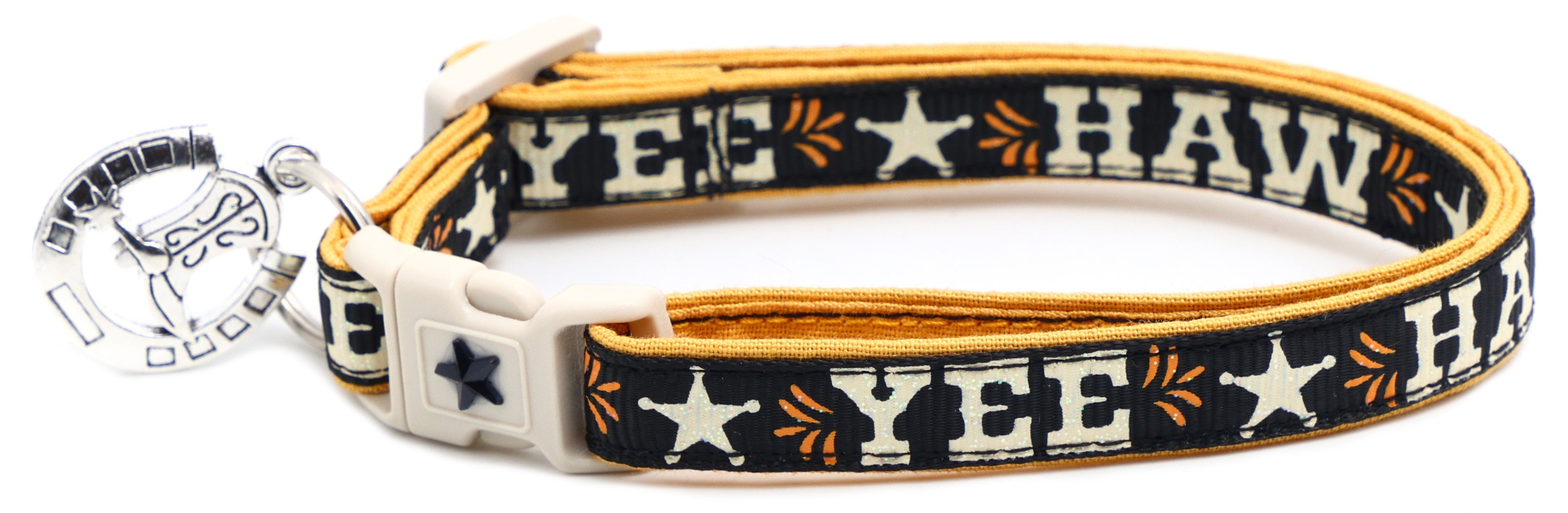 Navy breakaway pet collar with orange trim, white buckle, “YEE HAW” pattern