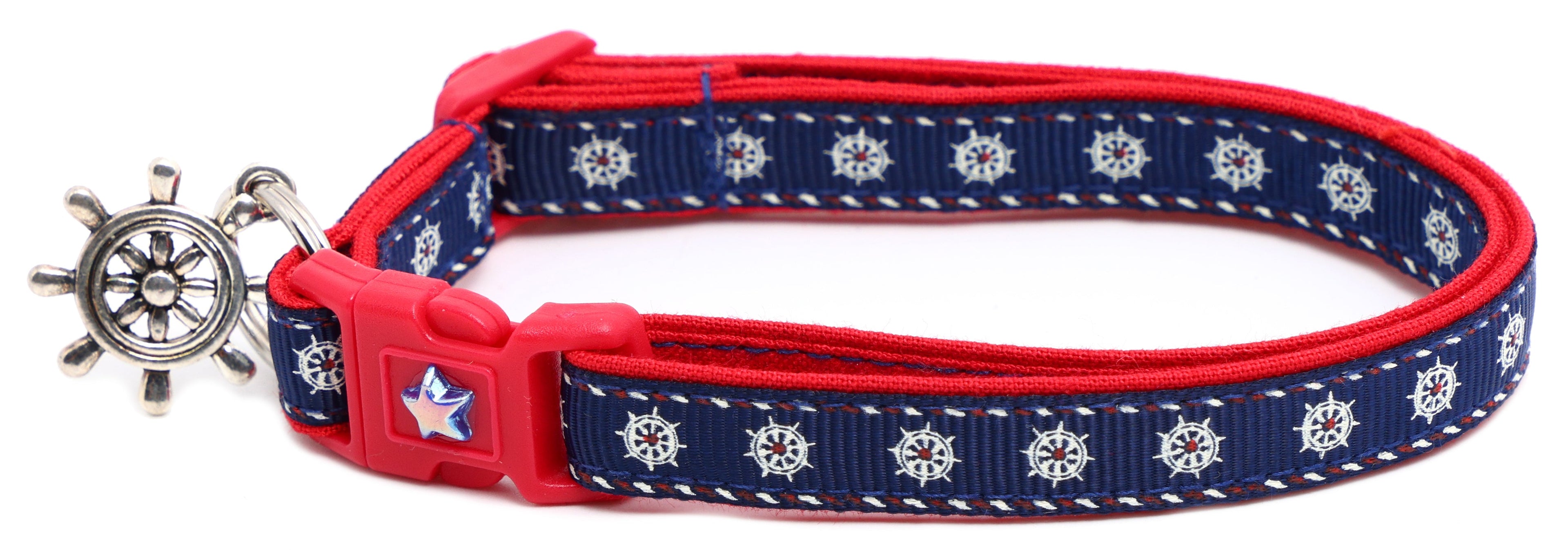 Navy ships wheel breakaway cat collar with red trim; ship wheel charm and star badge buckle.