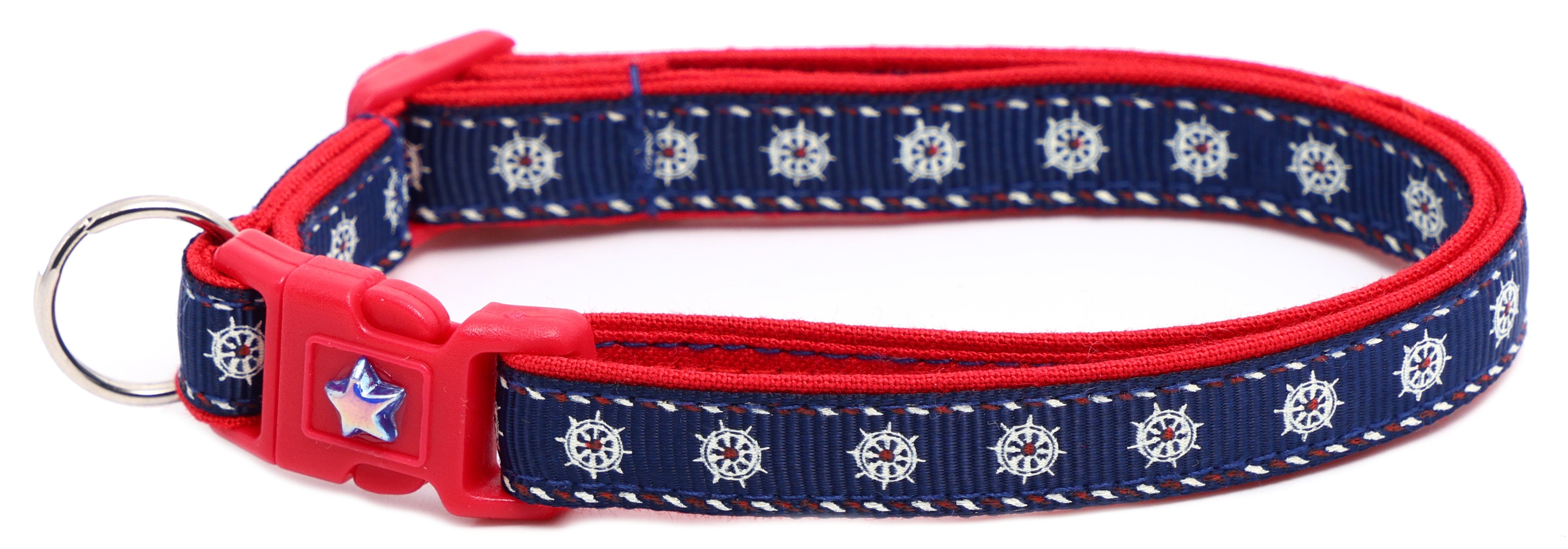Ships wheel breakaway cat collar, navy with red trim, star badge buckle, D-ring.