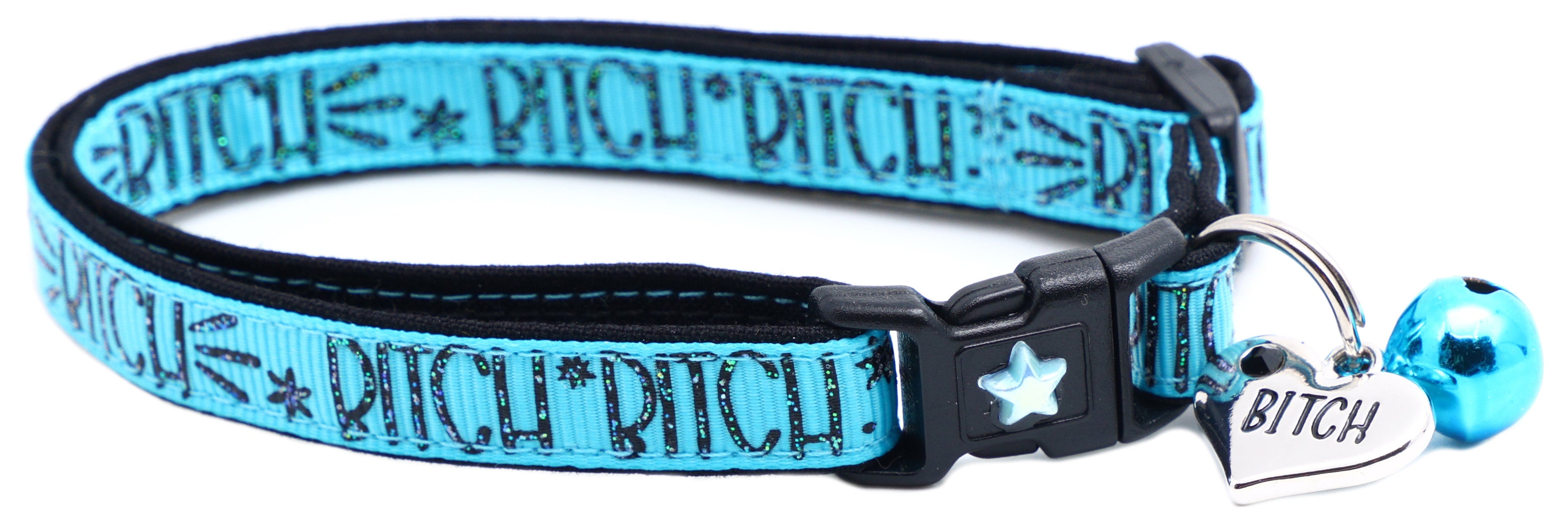 Blue fabric cat collar with black buckle, star emblem, BITCH tag and blue bell
