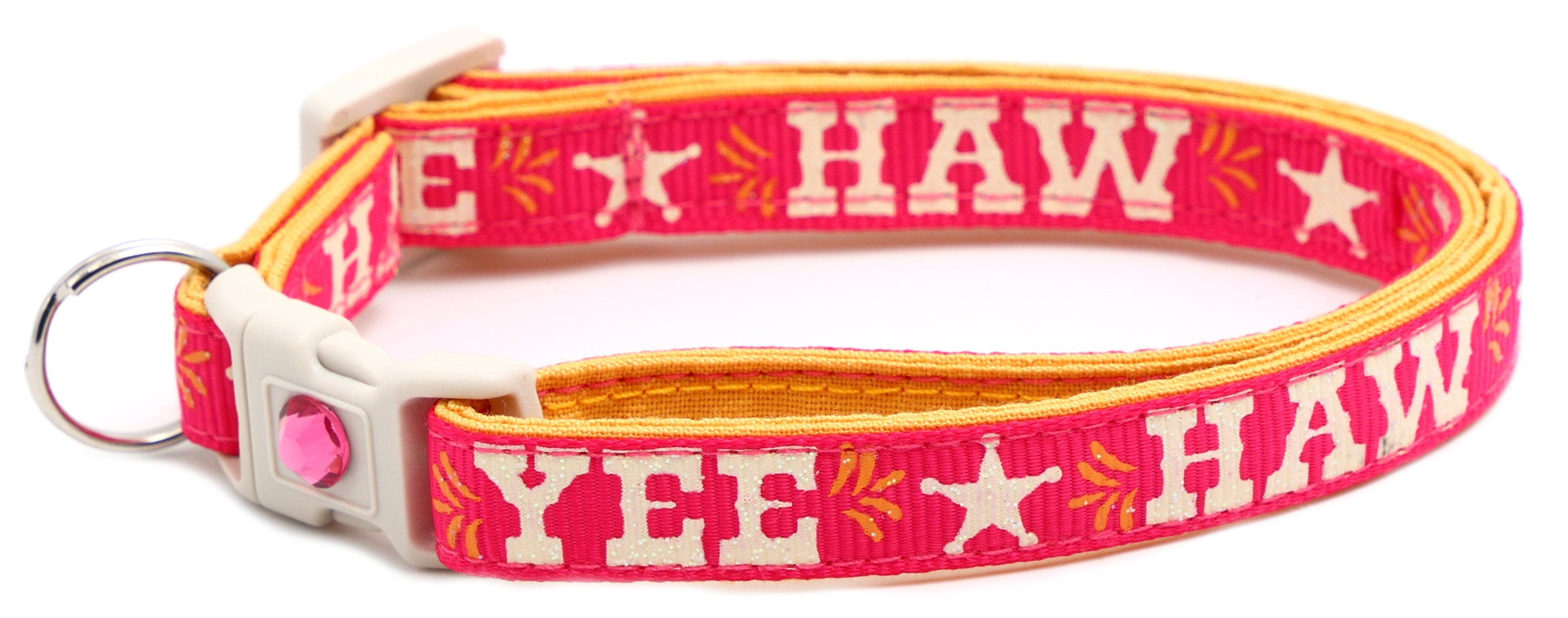 Hot pink breakaway pet collar with white buckle and “YEE HAW” star print