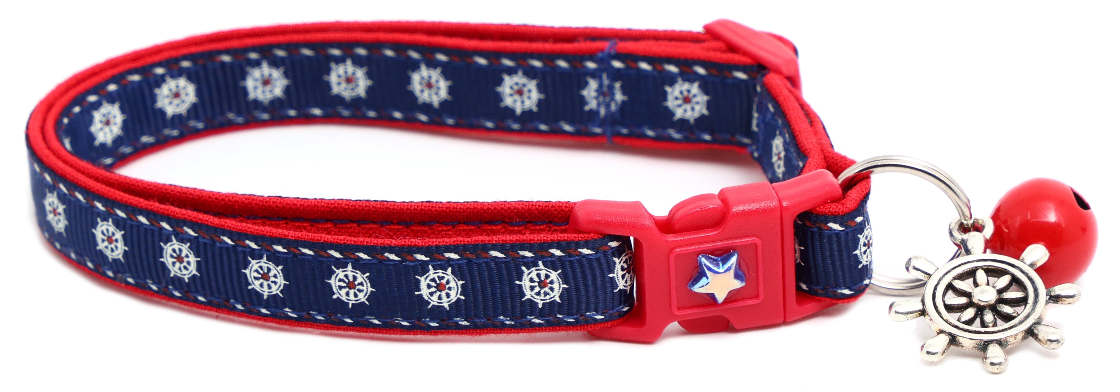 Navy ships wheel breakaway cat collar with red trim; ship wheel charm and star badge buckle.