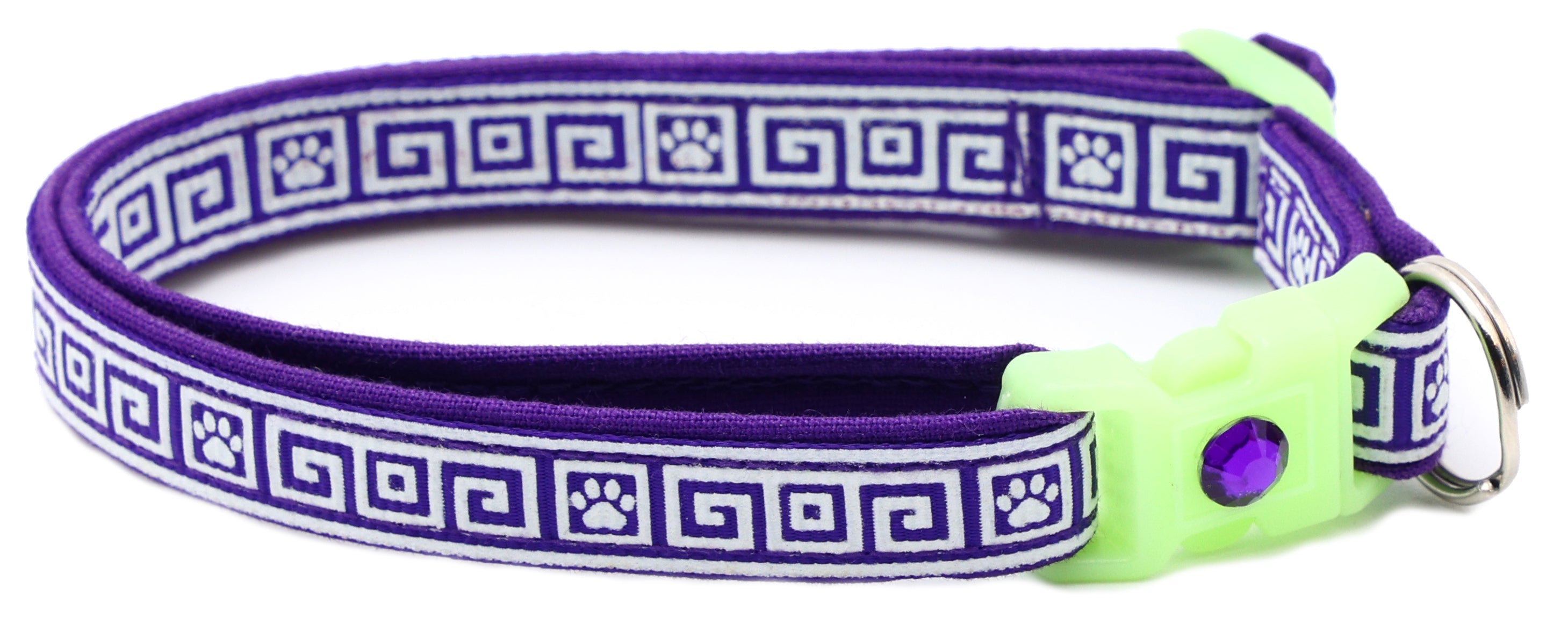 Breakaway cat collar with purple Greek key pattern, light green buckle, metal ring clasp, bell charm.