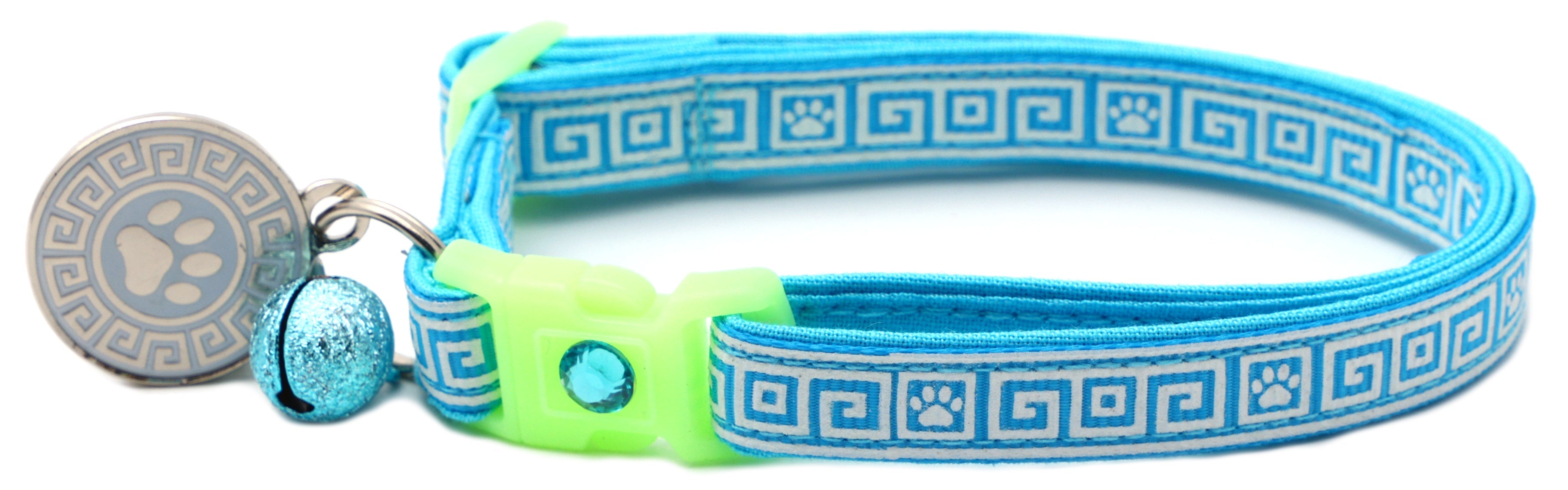Light blue Greek key cat collar with neon buckle, blue bell, and gray paw charm
