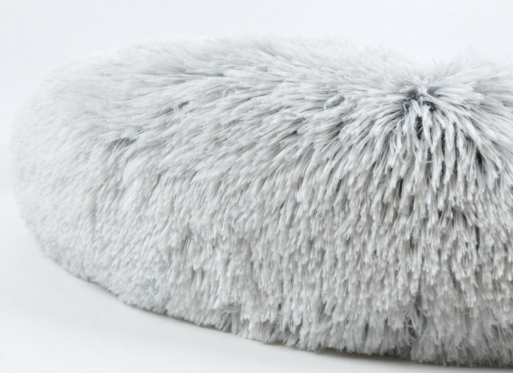 Light gray shag faux-fur pet bed top with tufted, fluffy loop texture