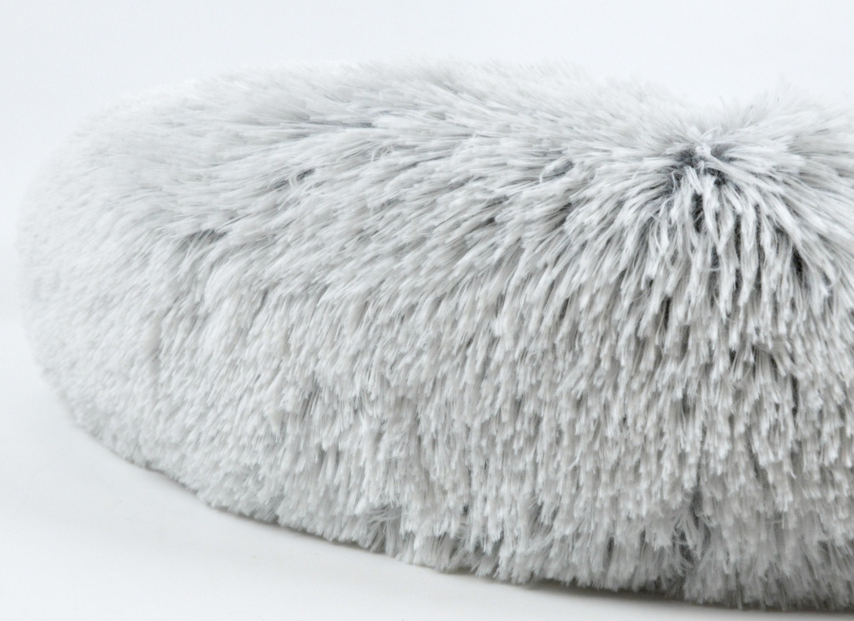 Light gray shag faux-fur pet bed top with tufted, fluffy loop texture
