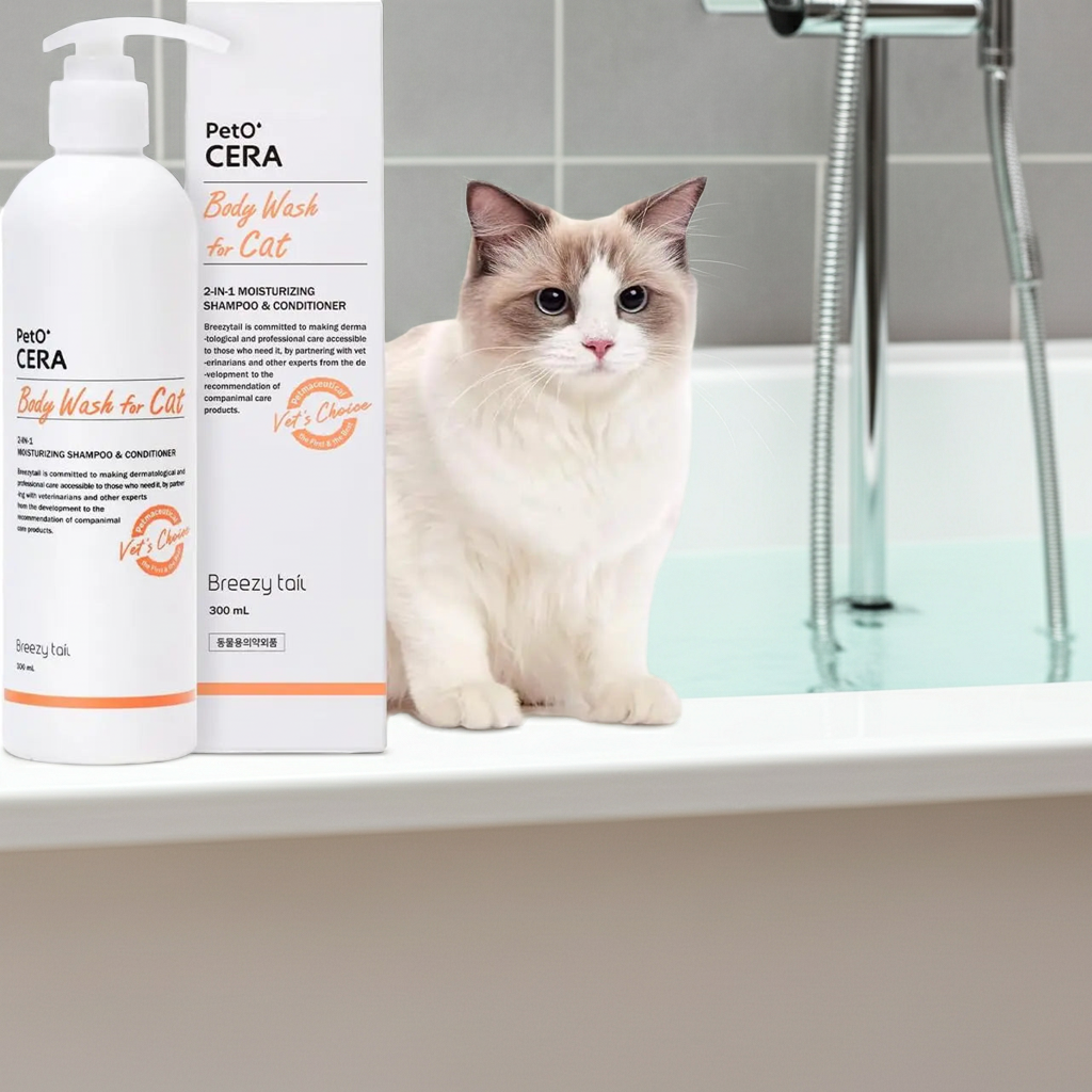 Cat shampoo bottle with pump, white label and orange accents