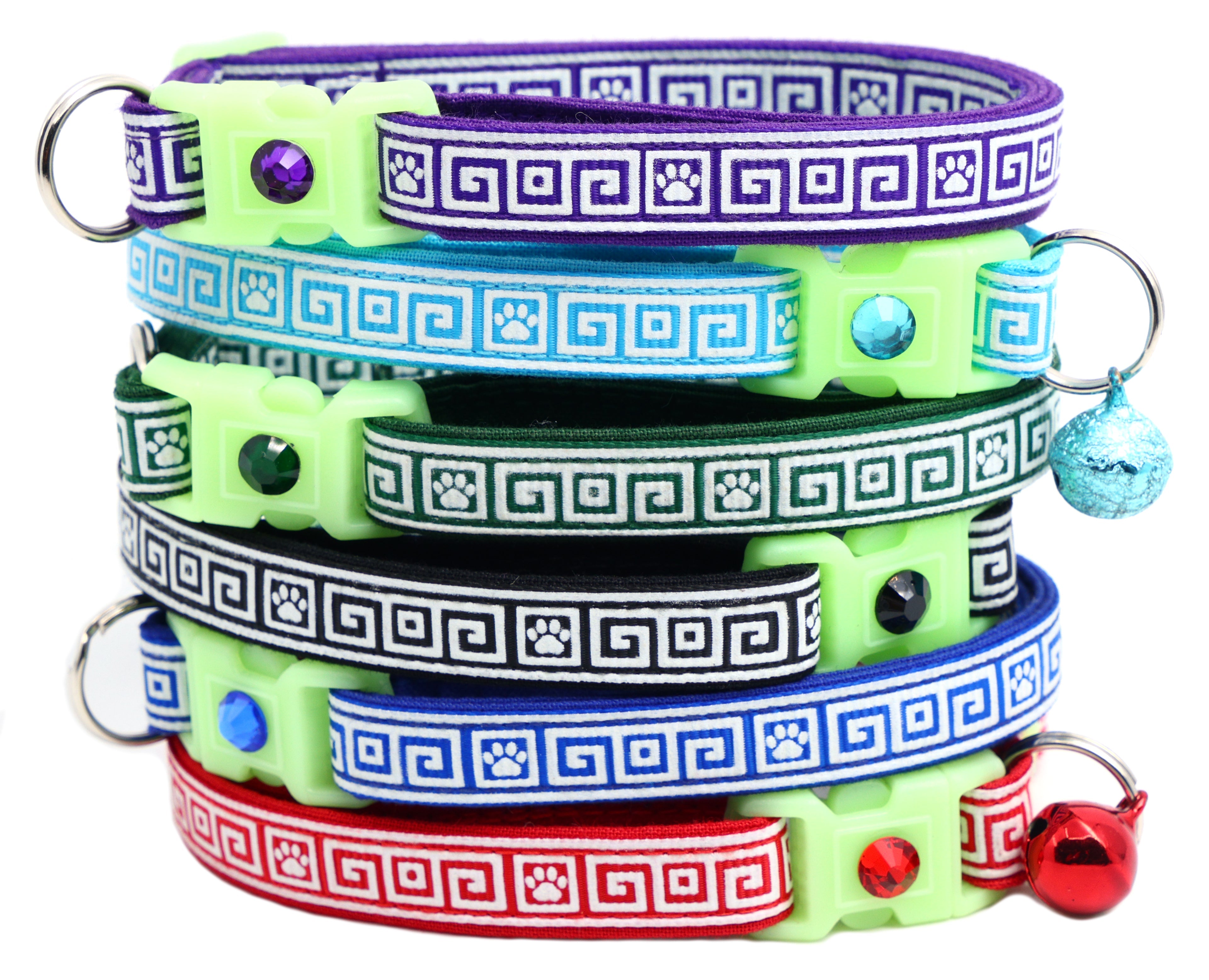 Set of breakaway cat collars stacked: purple, blue, green, black, with Greek key pattern and charms.