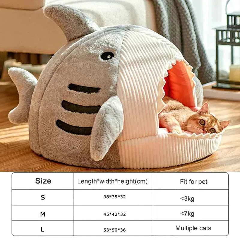 Grey shark cat bed cave with open front, ribbed white cushion and shark face design