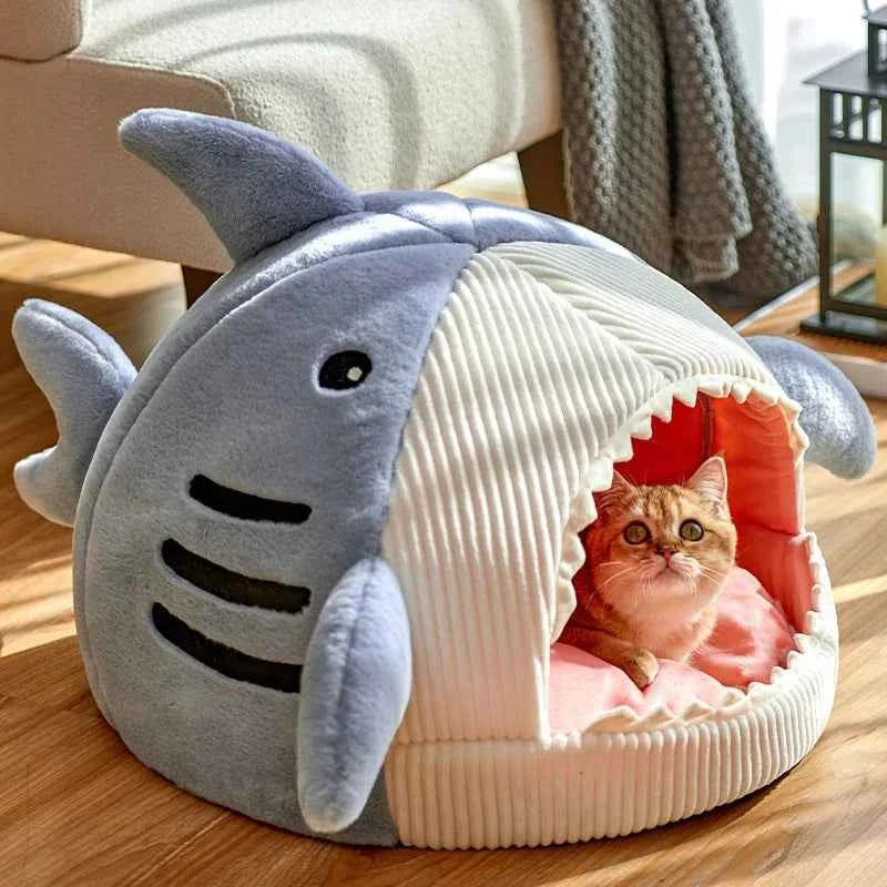 Blue shark cat bed cave with open front, ribbed white cushion, plush fins and face