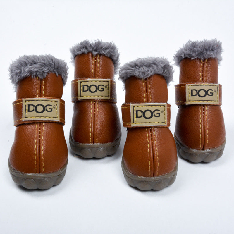 Brown waterproof dog snow boots with gray fuzzy cuffs and tan “DOG” logo straps