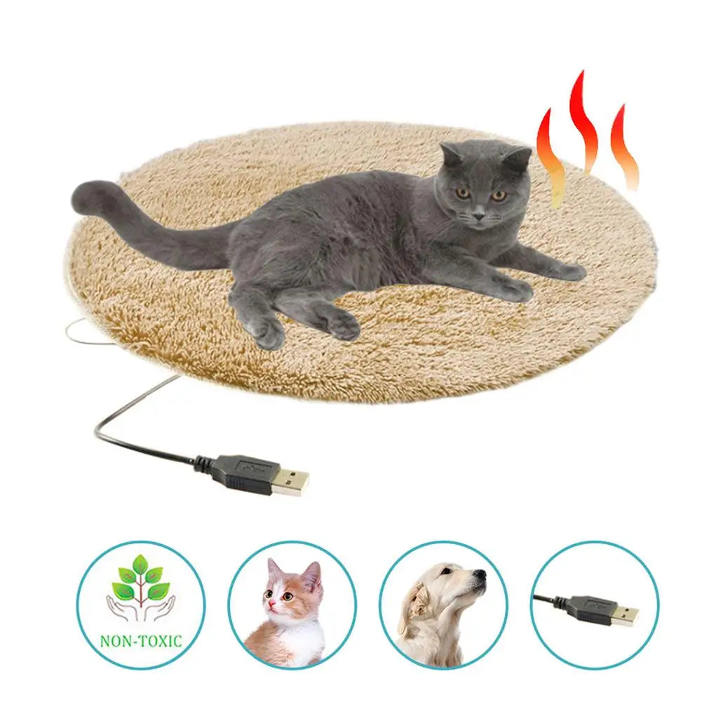 Brown oval heated pet bed mat with resting cat and USB cable
