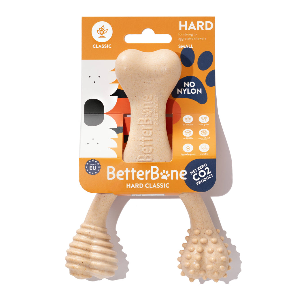 Hard classic chew bone toy, light beige, ribbed handle and nubby ball end