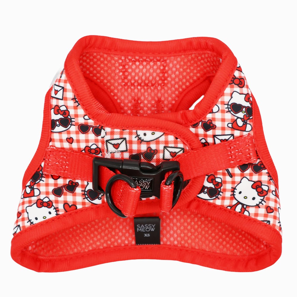 Cat step-in harness showing red textured panels and black plastic buckle closure