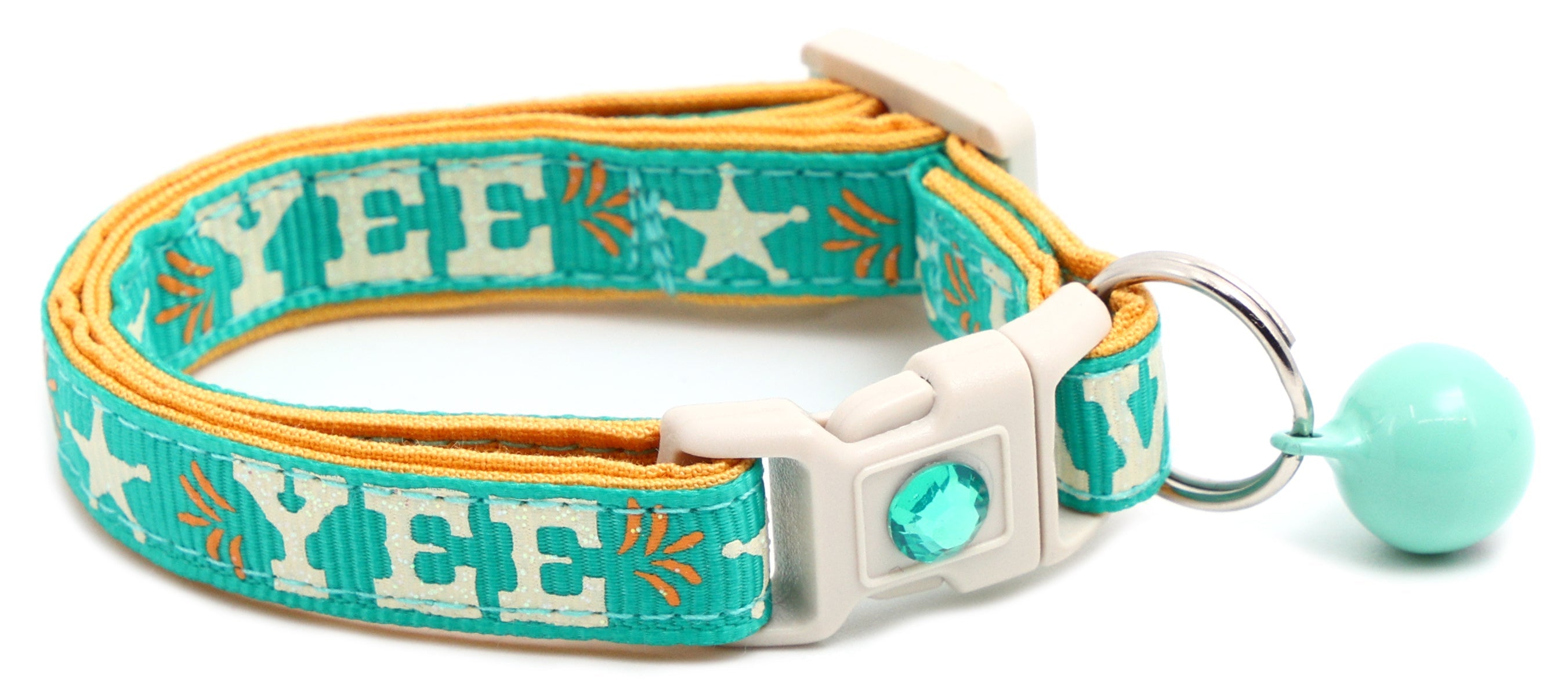 Breakaway dog collar, aqua with “YEE HAW” embroidery, white buckle, and mint bell