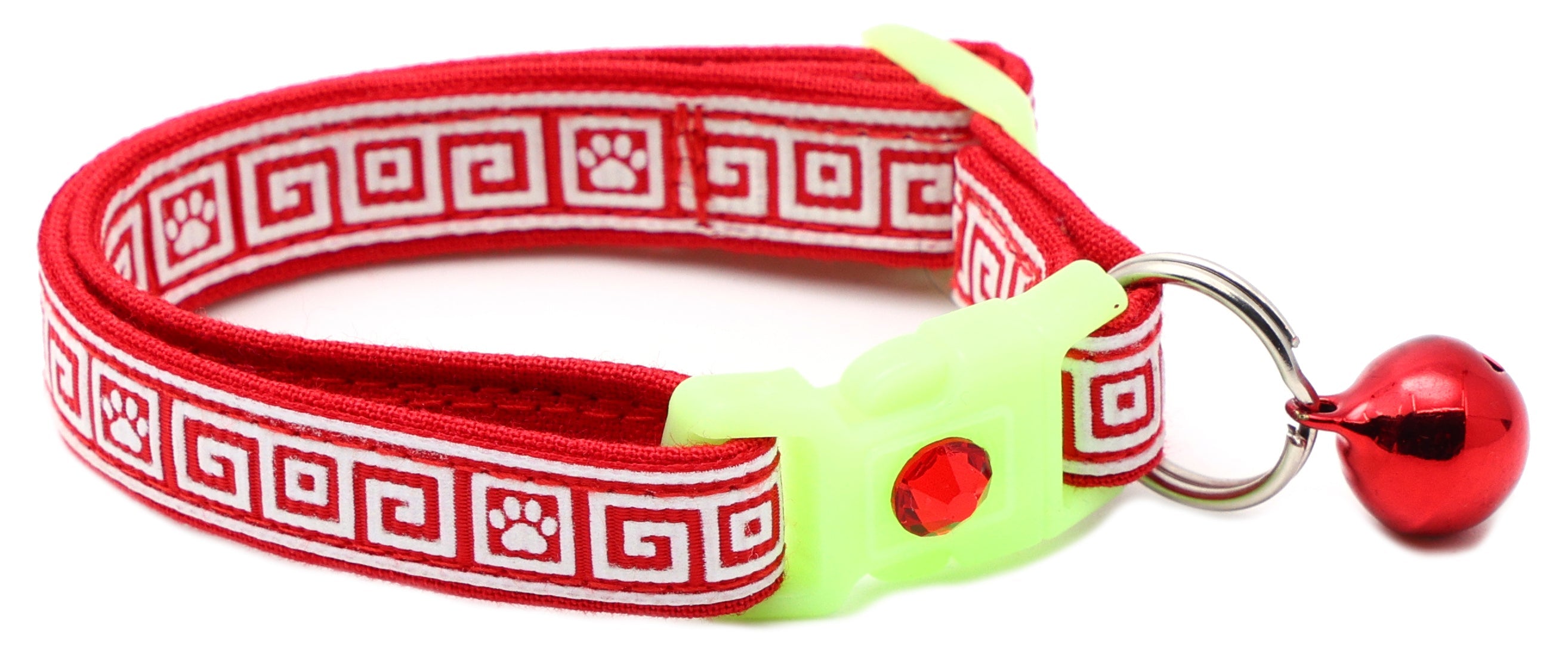 Breakaway cat collar with red Greek key pattern, light green buckle, metal ring clasp, red bell charm.